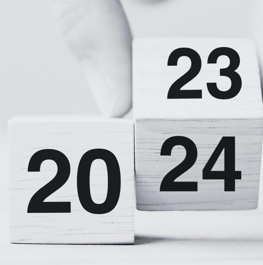 Two cubes with the year on them changing from 2023 to 2024