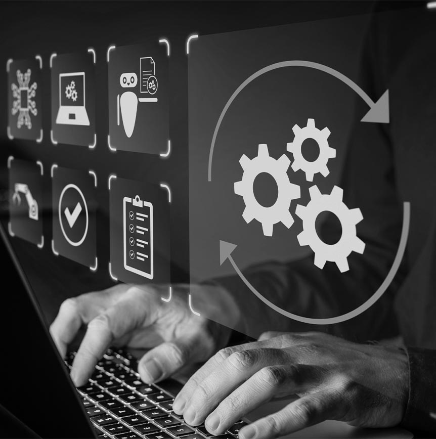 Employee typing on computer with projected screen