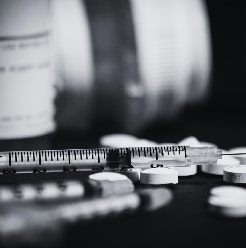 pill bottle and syringe, a call to action