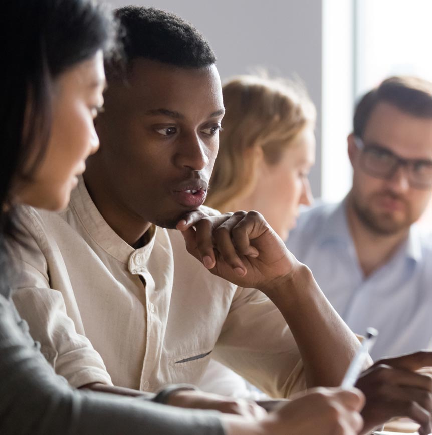 Coworkers collaborating on program strategy