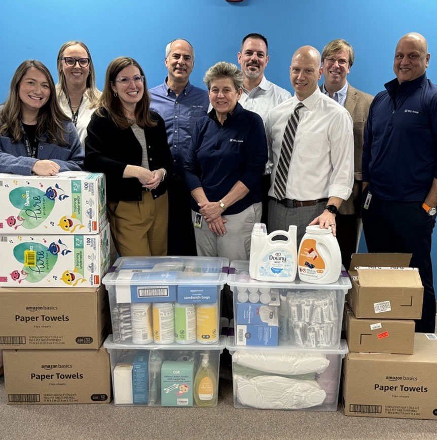 RELI team with donations for local charity