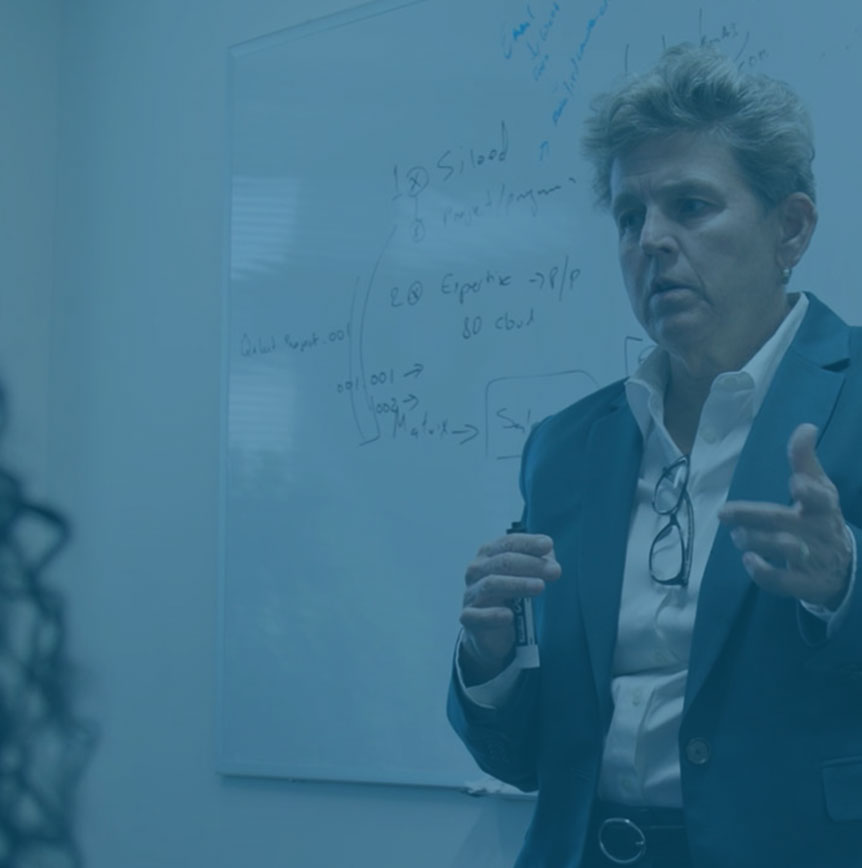 Tish Mossman speaking in front of whiteboard - Featured
