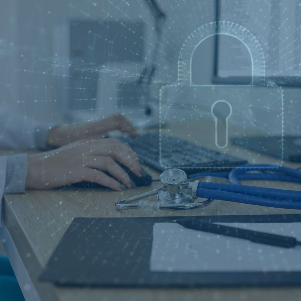Person typing near stethoscope and clipboard, with digital padlock overlay symbolizing data security in healthcare.