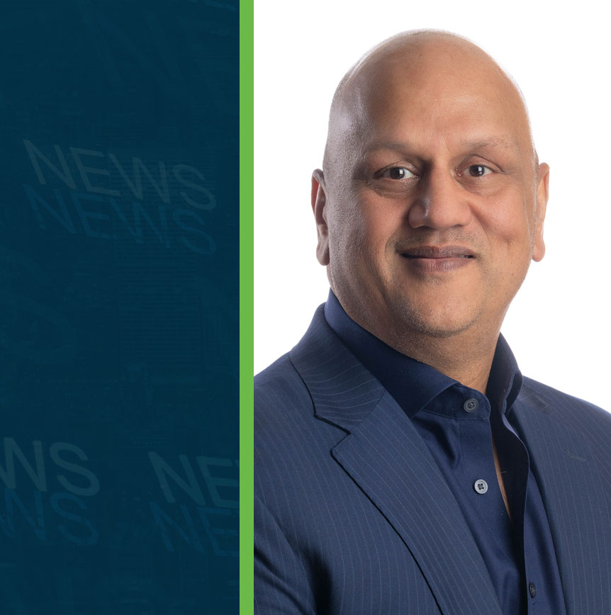 Vik Bansal of RELI Group alongside a graphic background with repeated ‘NEWS’ text