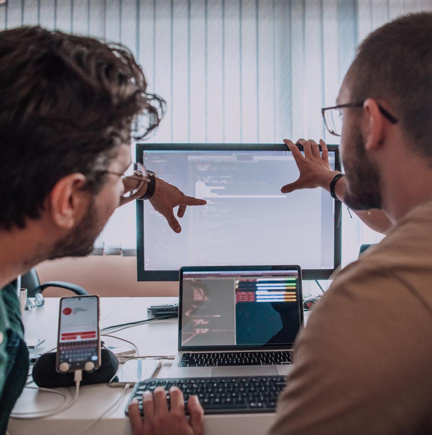 Two local government employees analyzing data for fraud, waste and abuse