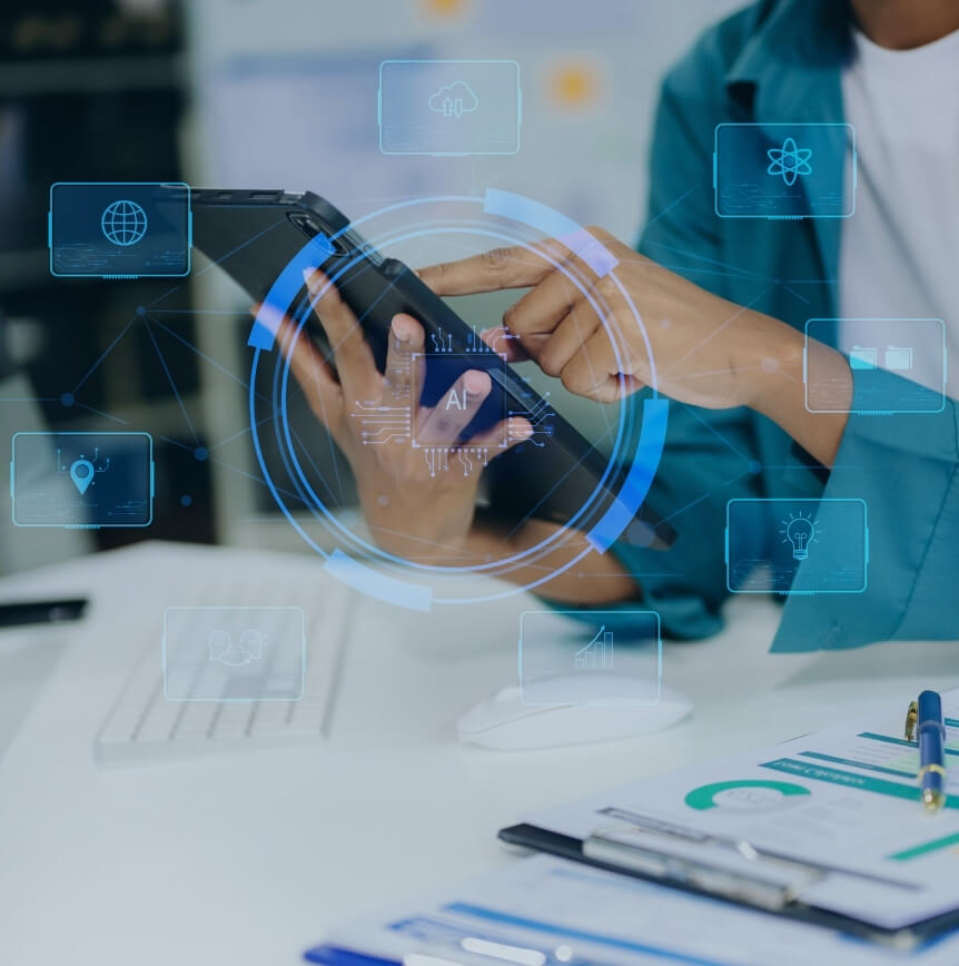 Person using a tablet with digital AI and data icons overlaying a modern workspace.