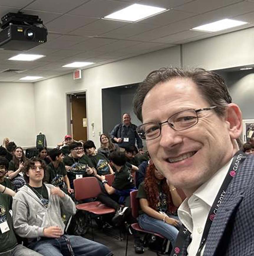 Jason Balser with students attending CyberSlam 2026