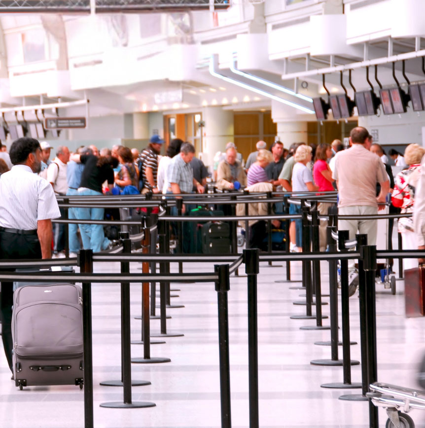 People waiting inline in an airport going through TSA security