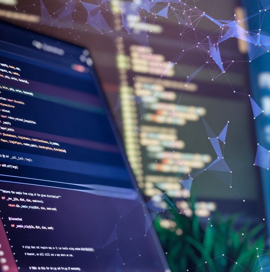 Close-up of computer code on multiple screens with a digital network overlay, representing domain-specific AI models and enterprise AI development.