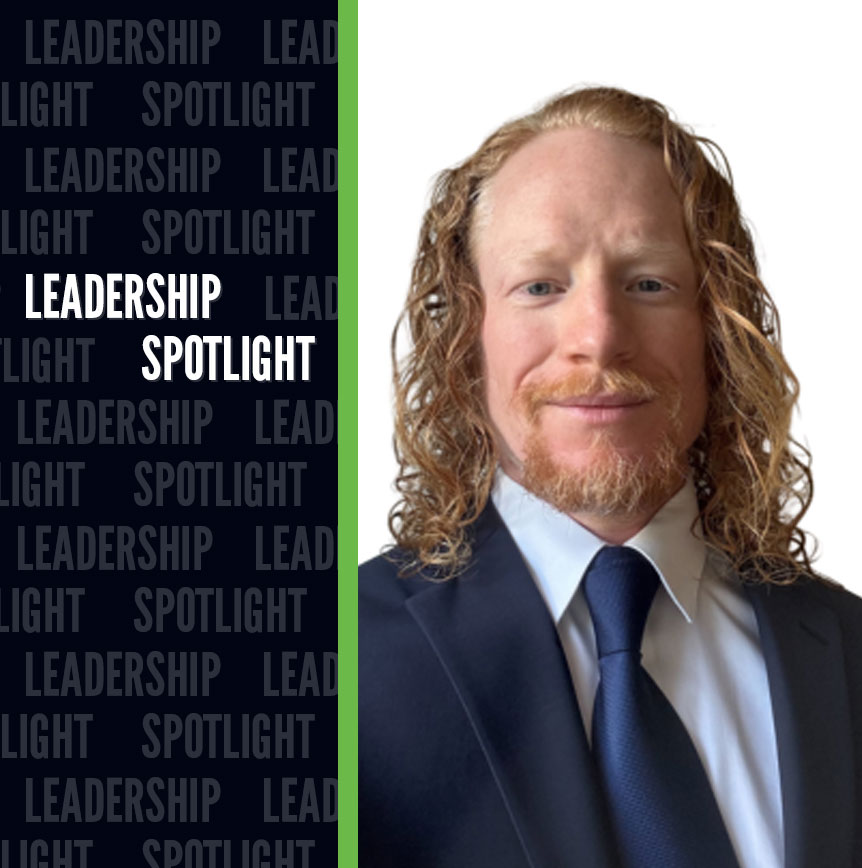 Leadership Spotlight graphic featuring a professional headshot in a dark suit and blue tie on a white background. A dark blue panel displays the text Leadership Spotlight in large white letters, with the phrase repeated as a background pattern and a green vertical accent line separating the text from the portrait.