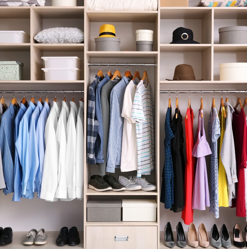 Organized closet with clothing, shoes, hats and storage containers