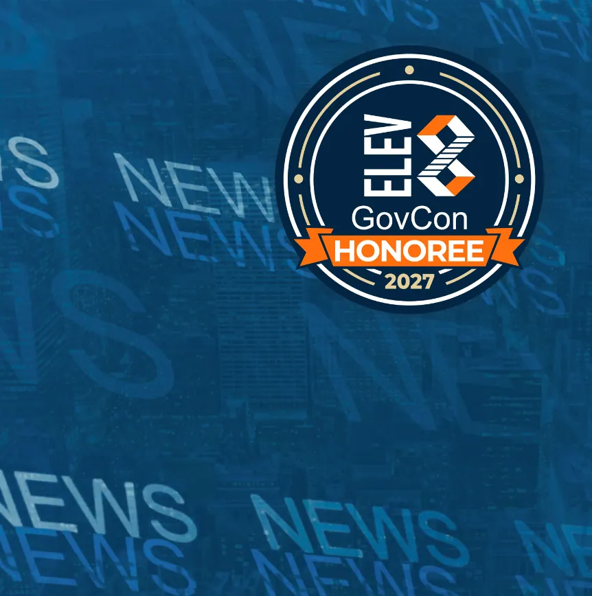 Circular navy badge reading "ELEV8 GovCon Honoree 2027" with an orange ribbon banner, set against a blue city skyline overlaid with repeated NEWS lettering.